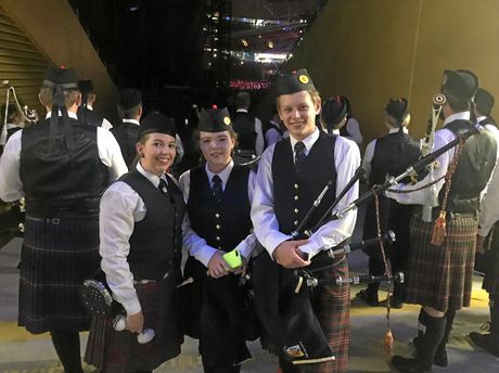 Past Drum Sergeant and SCOTS PGC College teacher Grace Peterson (Tenor drummer), SCOTS PGC College piper Abby Dalziel (Year 10) and SCOTS PGC College pipe major Jordan Simmers (Year 12) waiting to perform with Sir Paul McCartney in Brisbane last weekend.