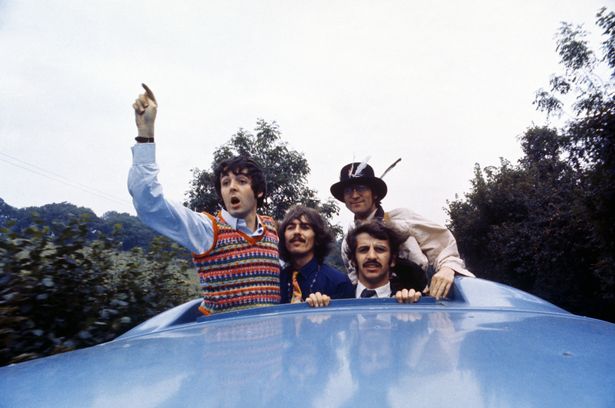 The Beatles look out of the Magical Mystery Tour coach skylight in September 1967