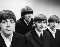 Which Beatle had the first solo number one hit?